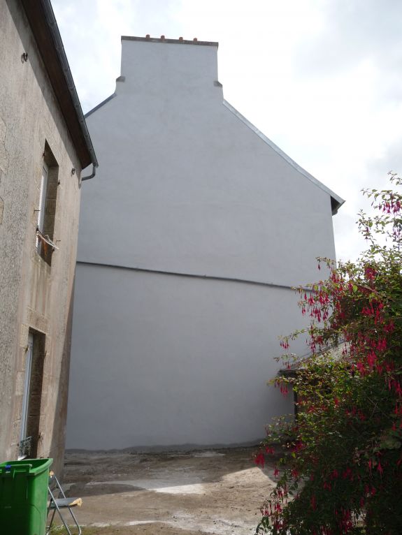 Pose d'enduit pour rénovation de pignon de maison